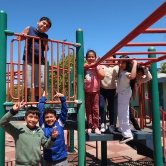 Kids smiling on school playground 